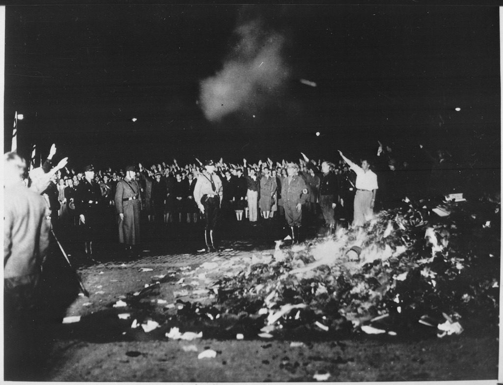 thousands_of_books_smoulder_in_a_huge_bonfire_as_germans_give_the_nazi_salute_during_the_wave_of_book-burnings_that._-_nara_-_535791.tif_.jpg